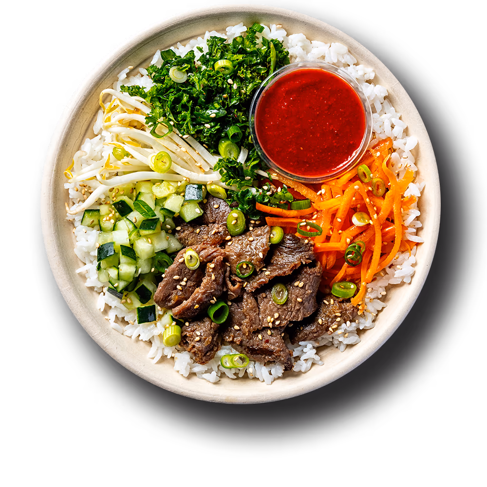 Classic bowl with bulgogi beef, white rice, bean sprouts, cucumbers, carrots and kale slaw