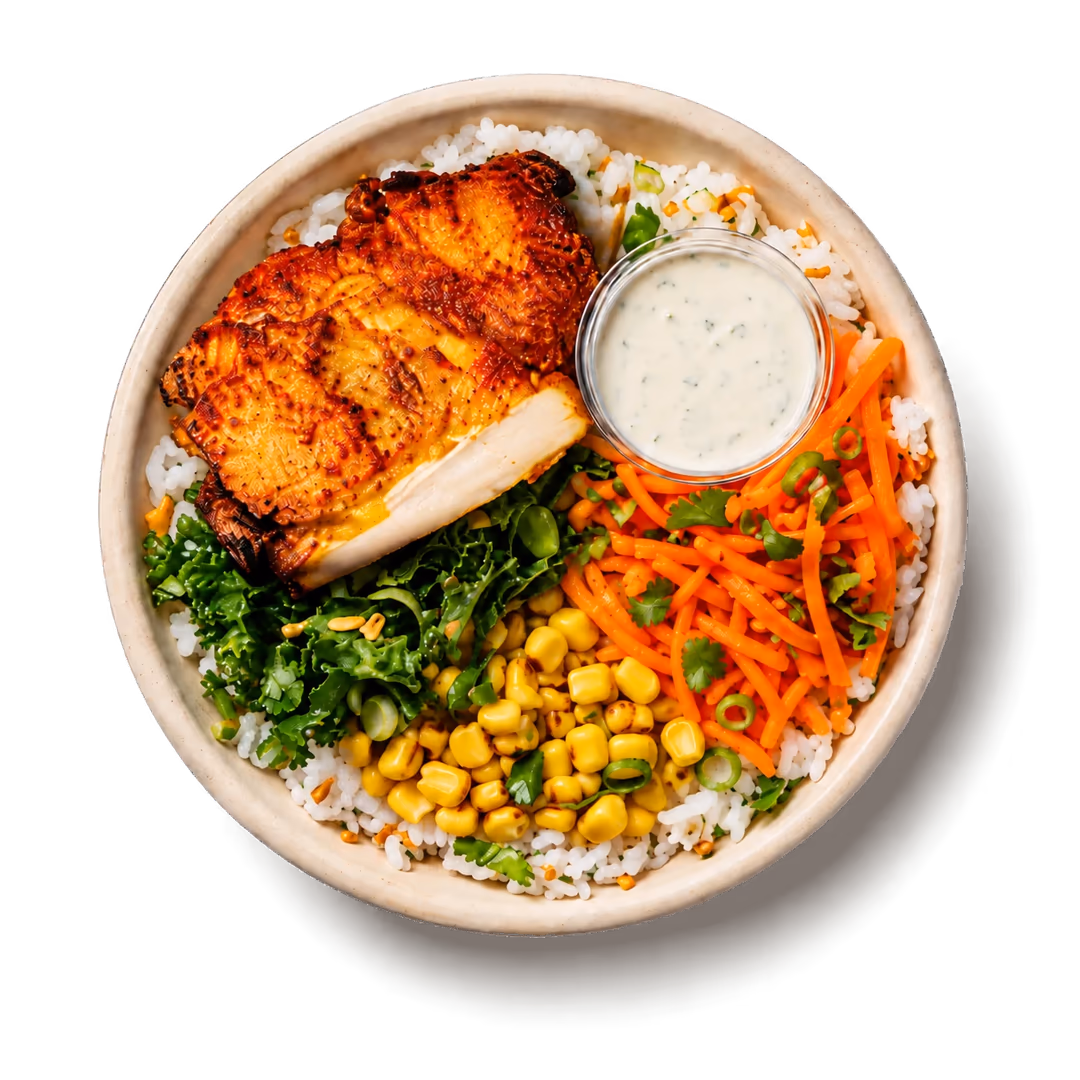 Southwest bowl with crispy chicken, white rice, corn, carrots and ranch